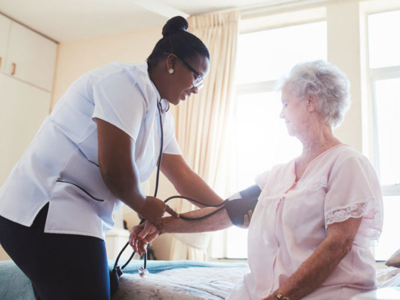 Nurse-checking-blood-pressure-img